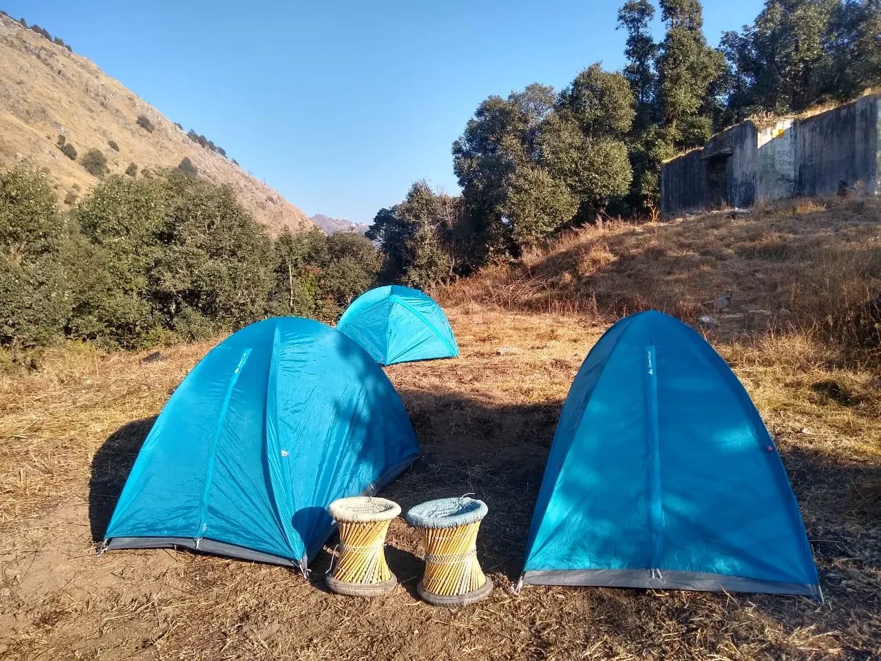 Blue tents on hillside