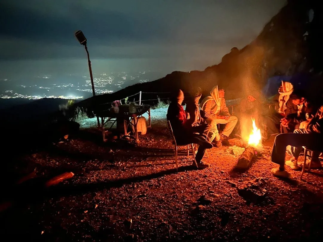 Bonfire with night city view