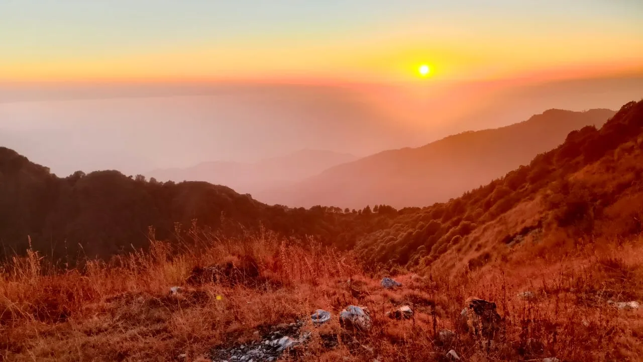 Golden sunset over mountain layers
