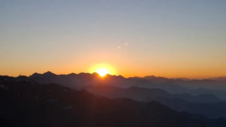 Golden sunrise over peaks