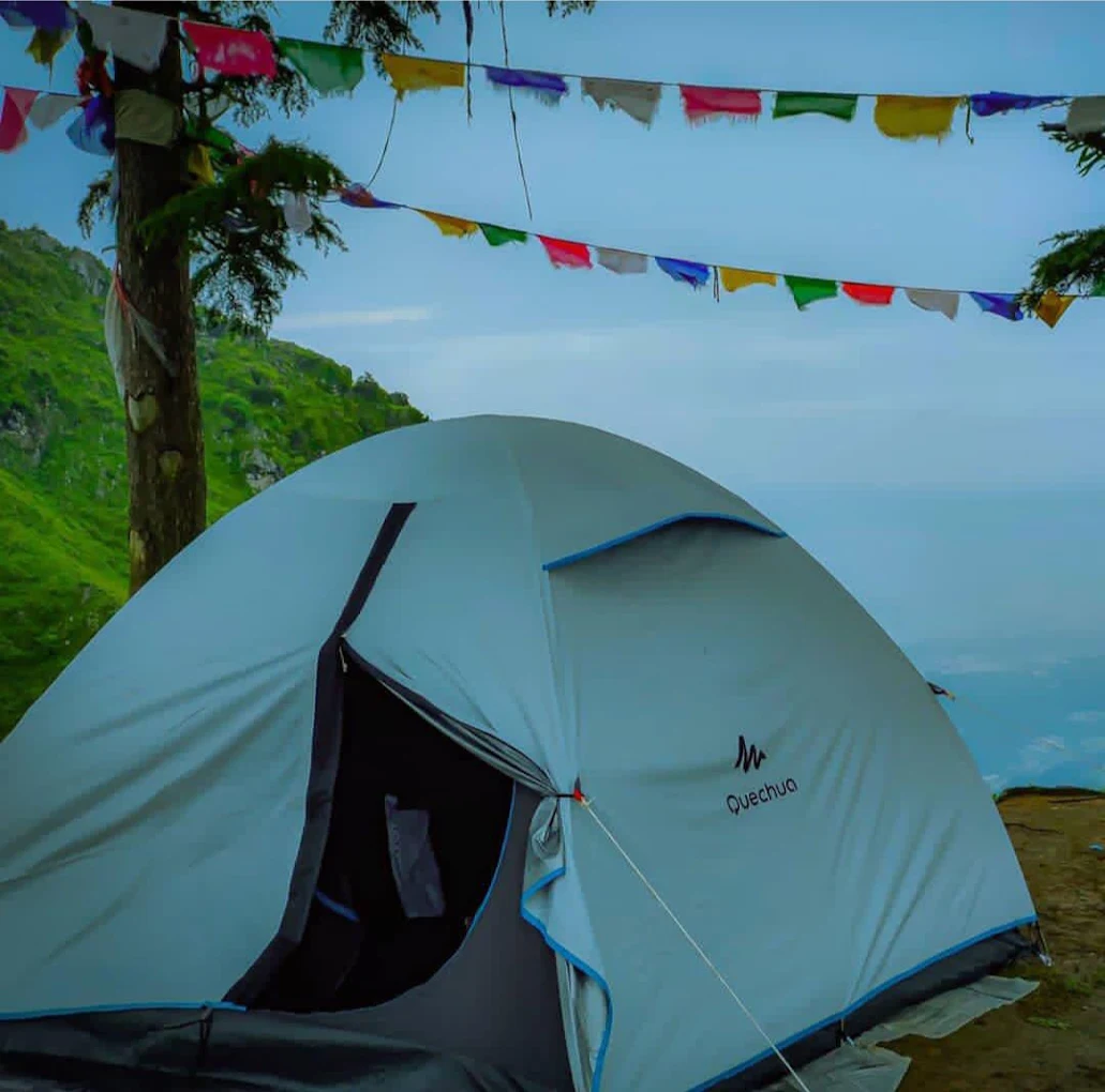 Tents with prayer flags and valley view