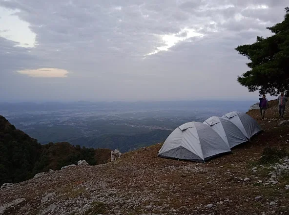 Tents on ridge with cloudy valley
