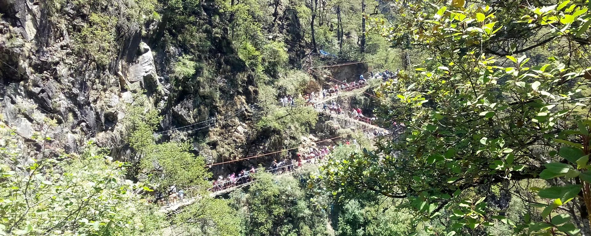 Hikers ascending a ridge path above Mussoorie