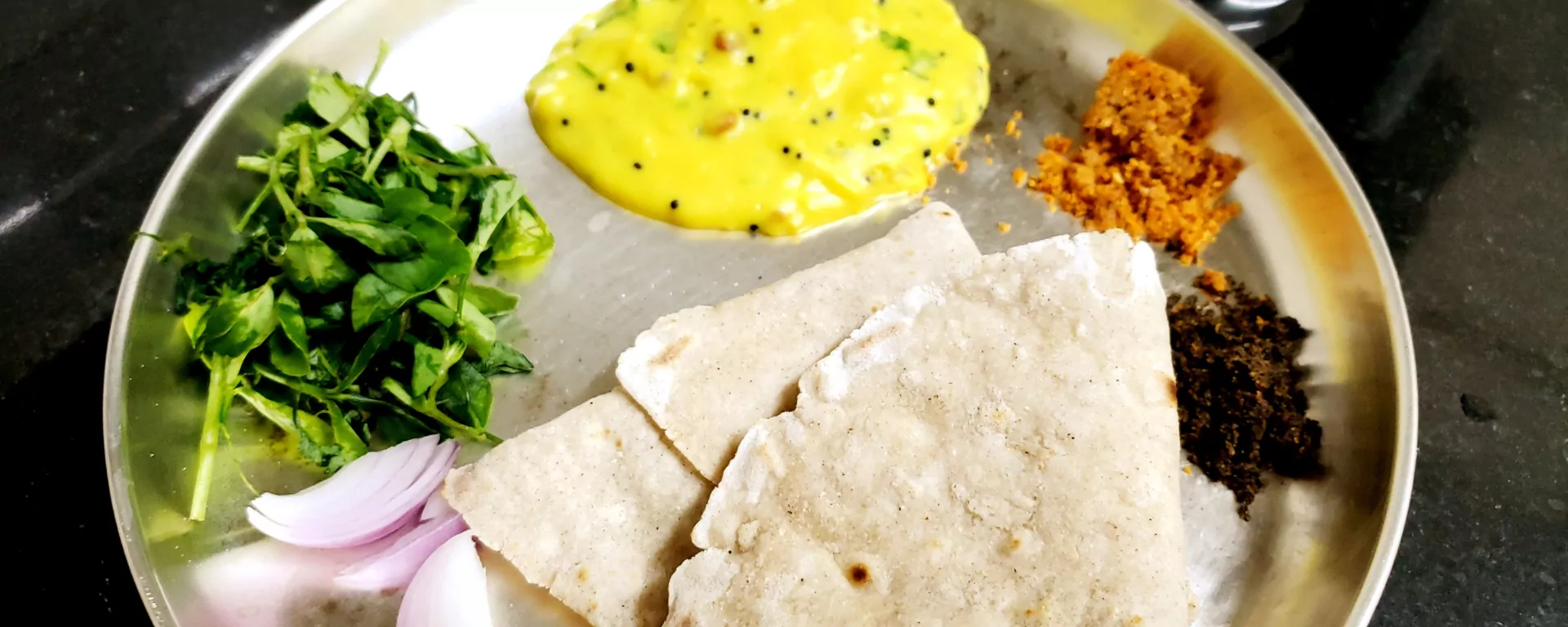 Guests enjoying a traditional Pahadi meal together