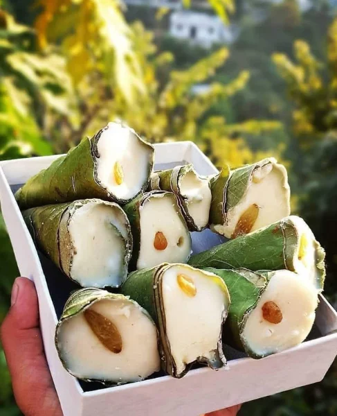 Kumaoni Singodi — sweet khoya rolls wrapped in fresh malu leaves