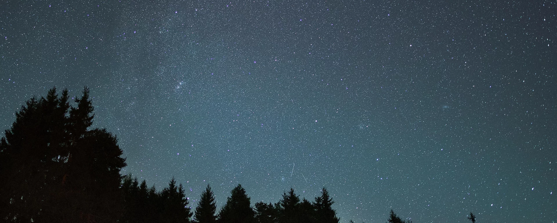 Telescope pointed at the Milky Way from the Pahadi House deck