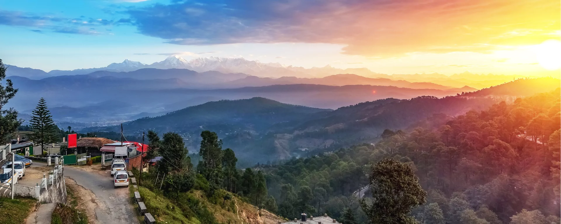 Valley filling with golden light below the trail