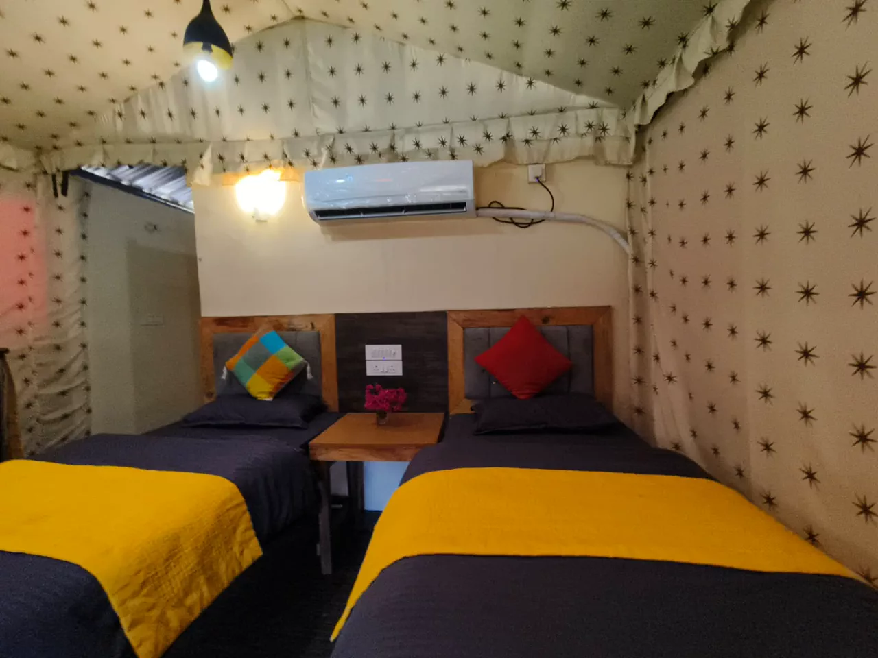 Air-conditioned cottage with twin beds at the riverside camp in Rishikesh