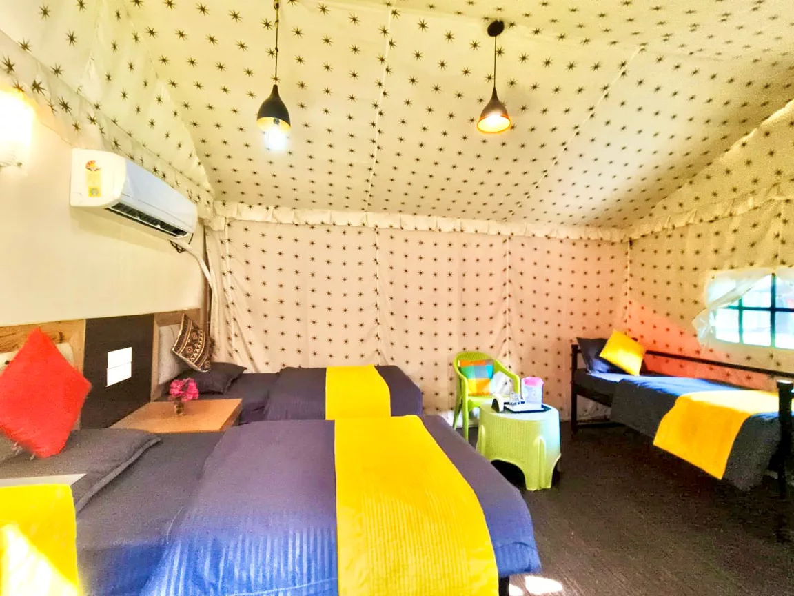 Maharaja family suite with triple beds at the river side camp in Rishikesh