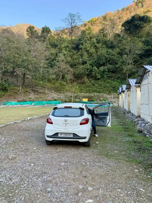 On-site parking with hill and river views at the riverside camp in Rishikesh