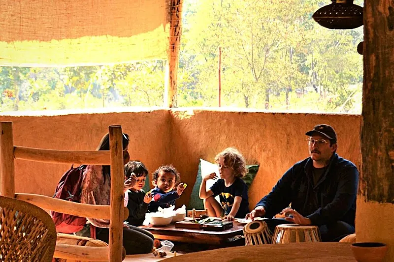Guests relaxing in the open-air lounge at the Rajaji wilderness retreat
