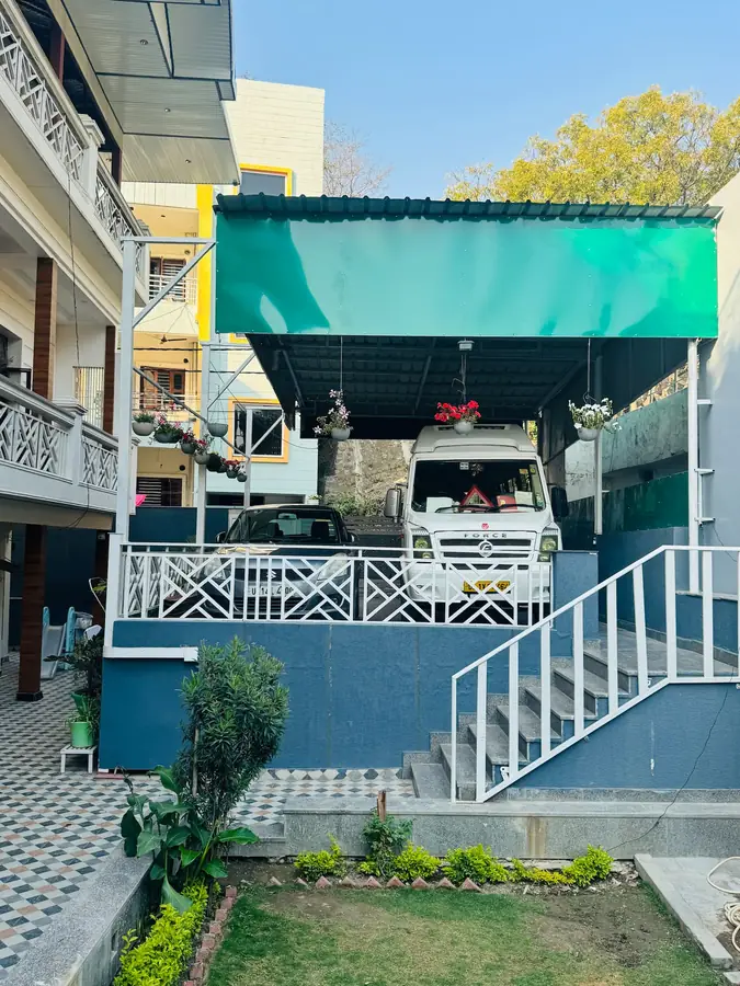 Covered parking for cars and a tempo traveller at Prembasant Homestay, Rishikesh