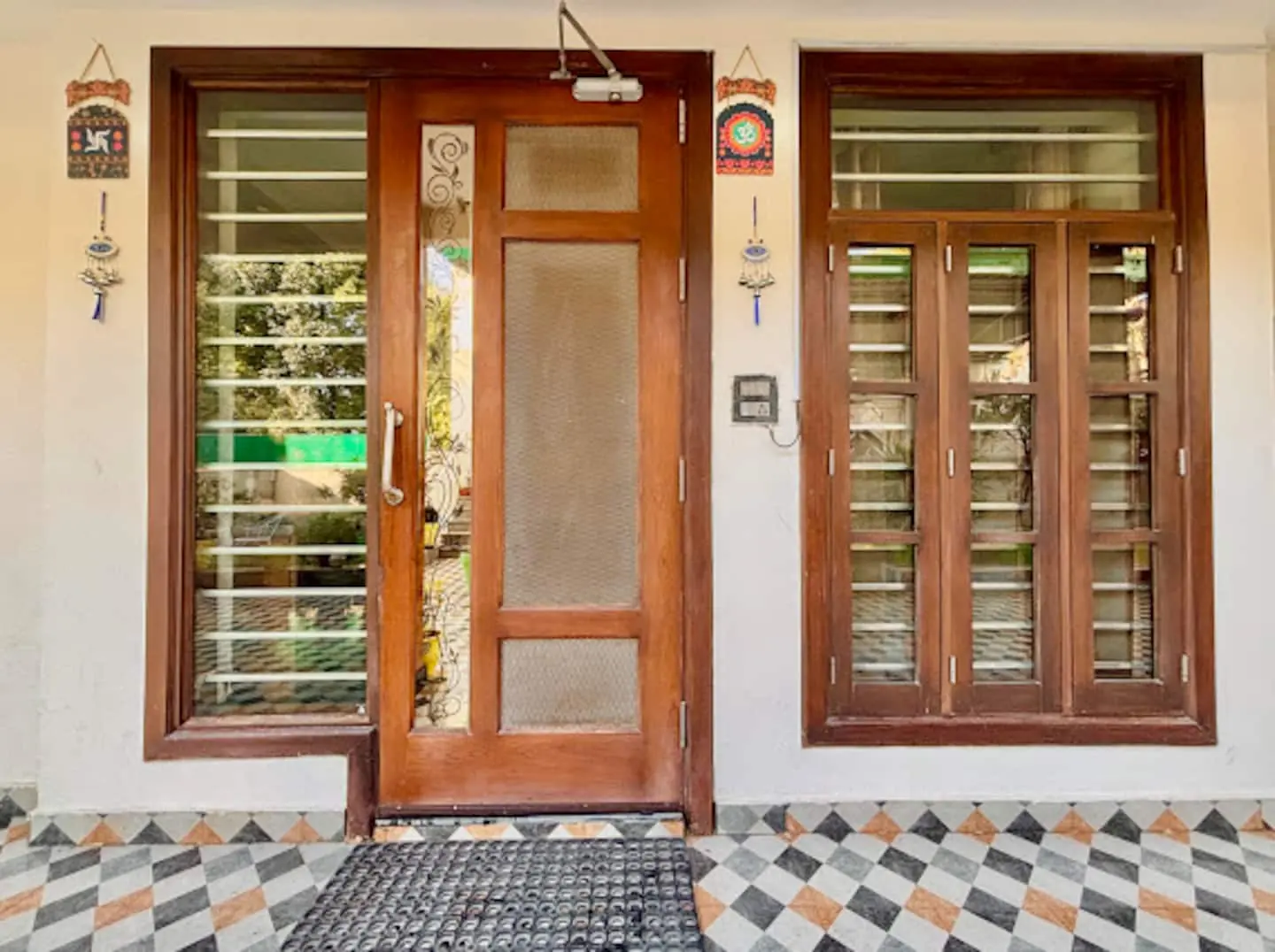 Wooden doors and windows at the entrance of Prembasant Homestay