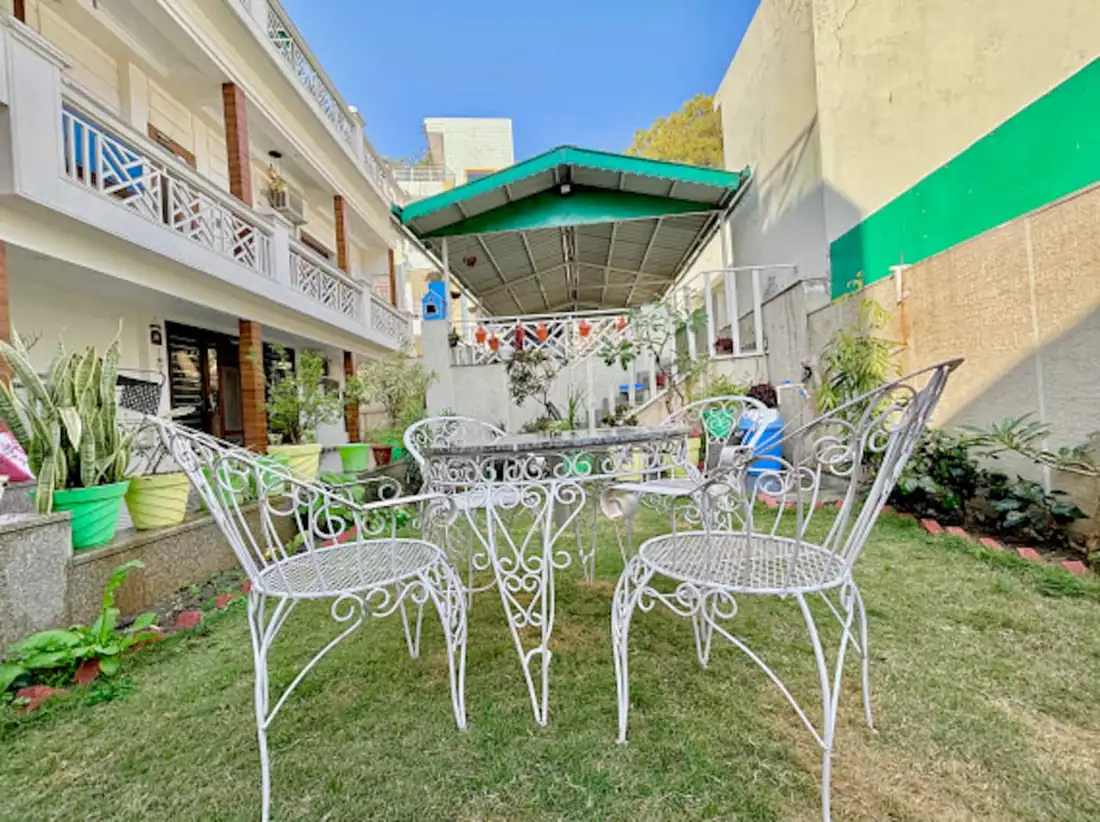 Garden seating beside the covered patio at Prembasant Homestay