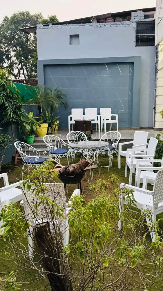 Terrace seating in the garden at Prembasant Homestay, Rishikesh