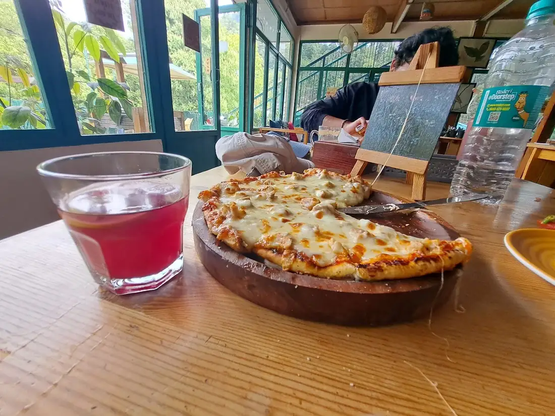 Wood-fired pizza and a drink at the Seegreen cafe, Mussoorie
