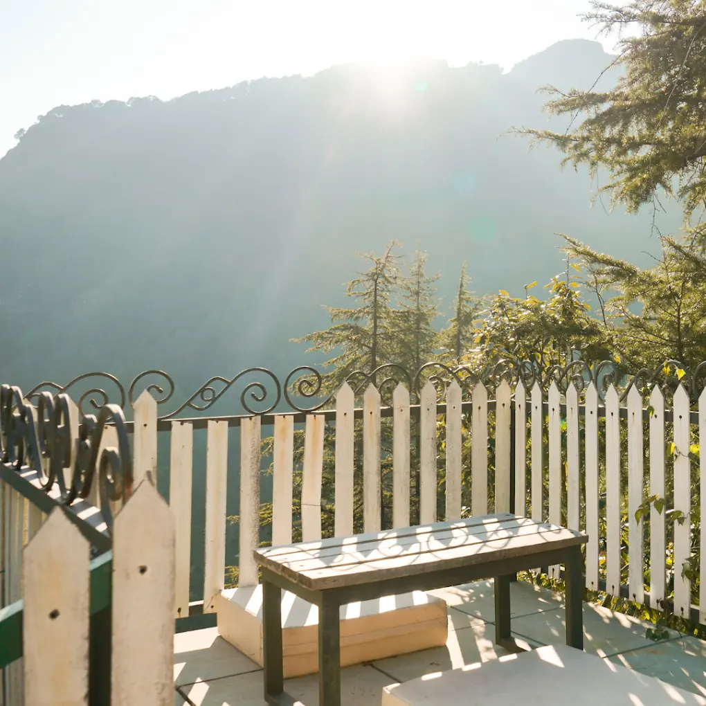 Misty sunrise from the rooftop deck at Seegreen Mussoorie