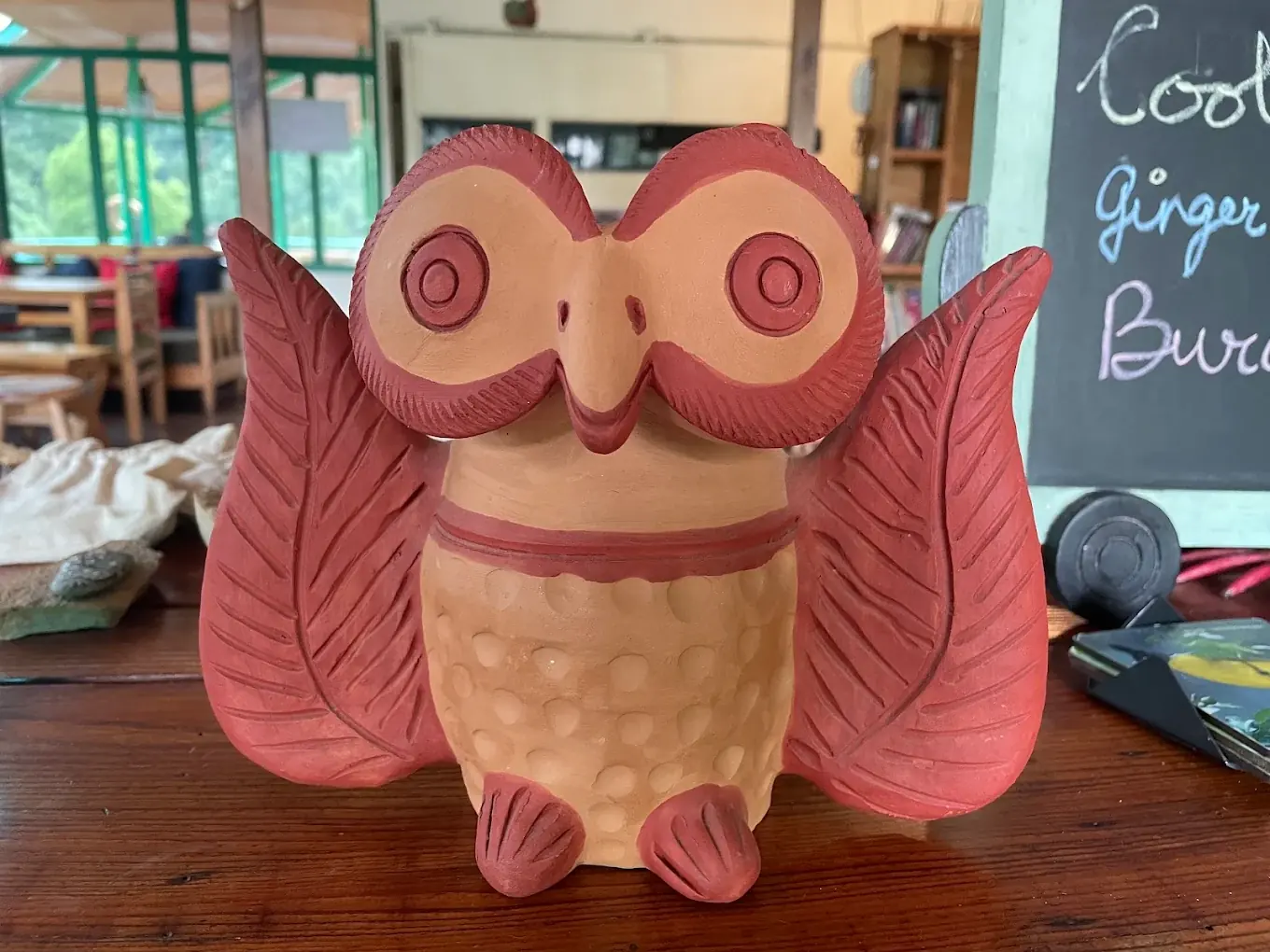 The Seegreen owl mascot and cafe menu board, Mussoorie