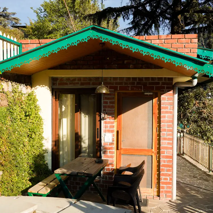 Brick-and-wood cabin exterior at Seegreen Lodges Mussoorie