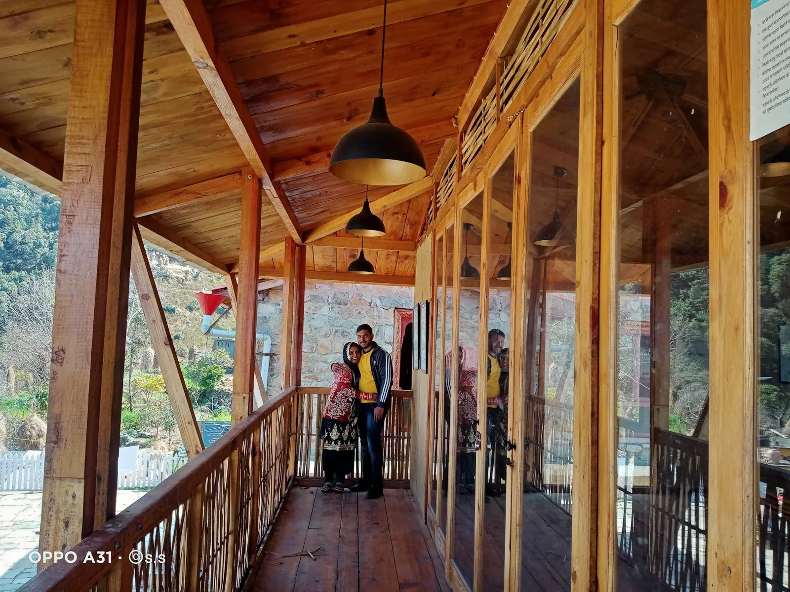 Long verandah with hanging lamps at Basa Stay, Khirsu, Pauri Garhwal