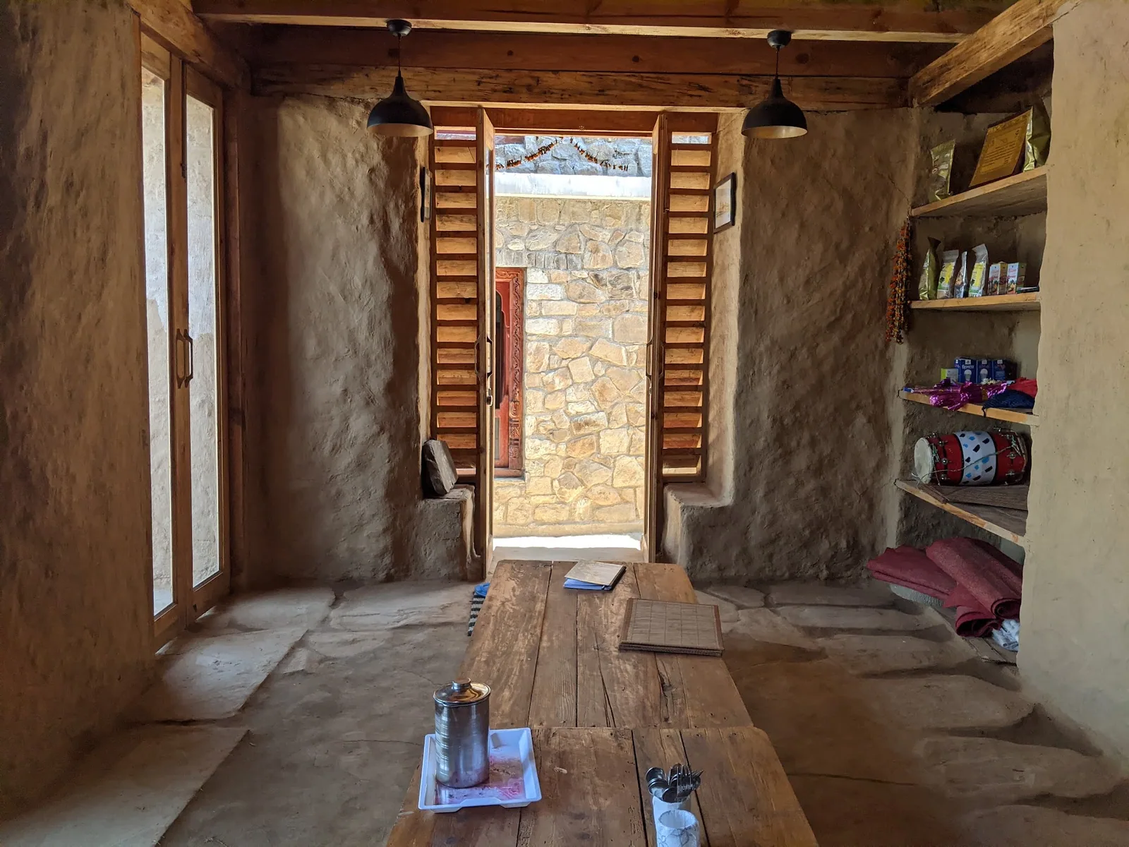 Doorway through the stone wall into the courtyard at Basa Stay, Khirsu