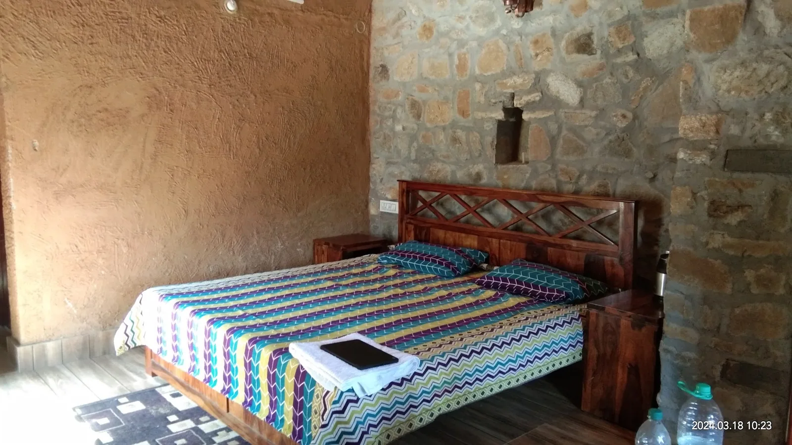 Bedroom with a wooden bed frame at Basa Stay, Khirsu, Pauri Garhwal