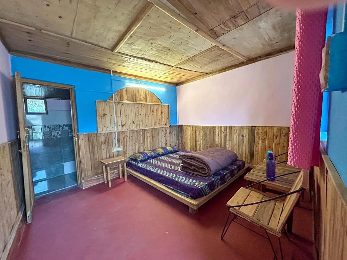 Room with wooden walls and a window at Darshan Village Stay, Mussoorie range