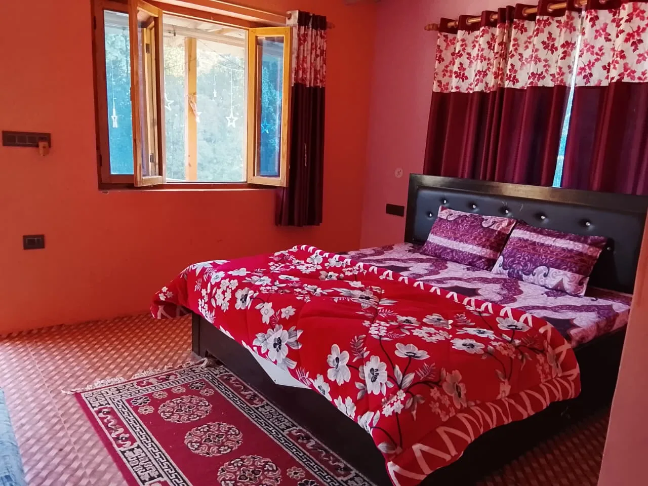 Room with a blue window frame at Ghughuti Homestay, Sunkiya
