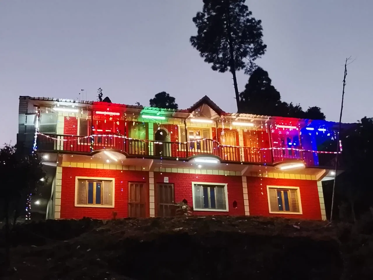 Ghughuti Homestay lit up after dark at Sunkiya, Mukteshwar