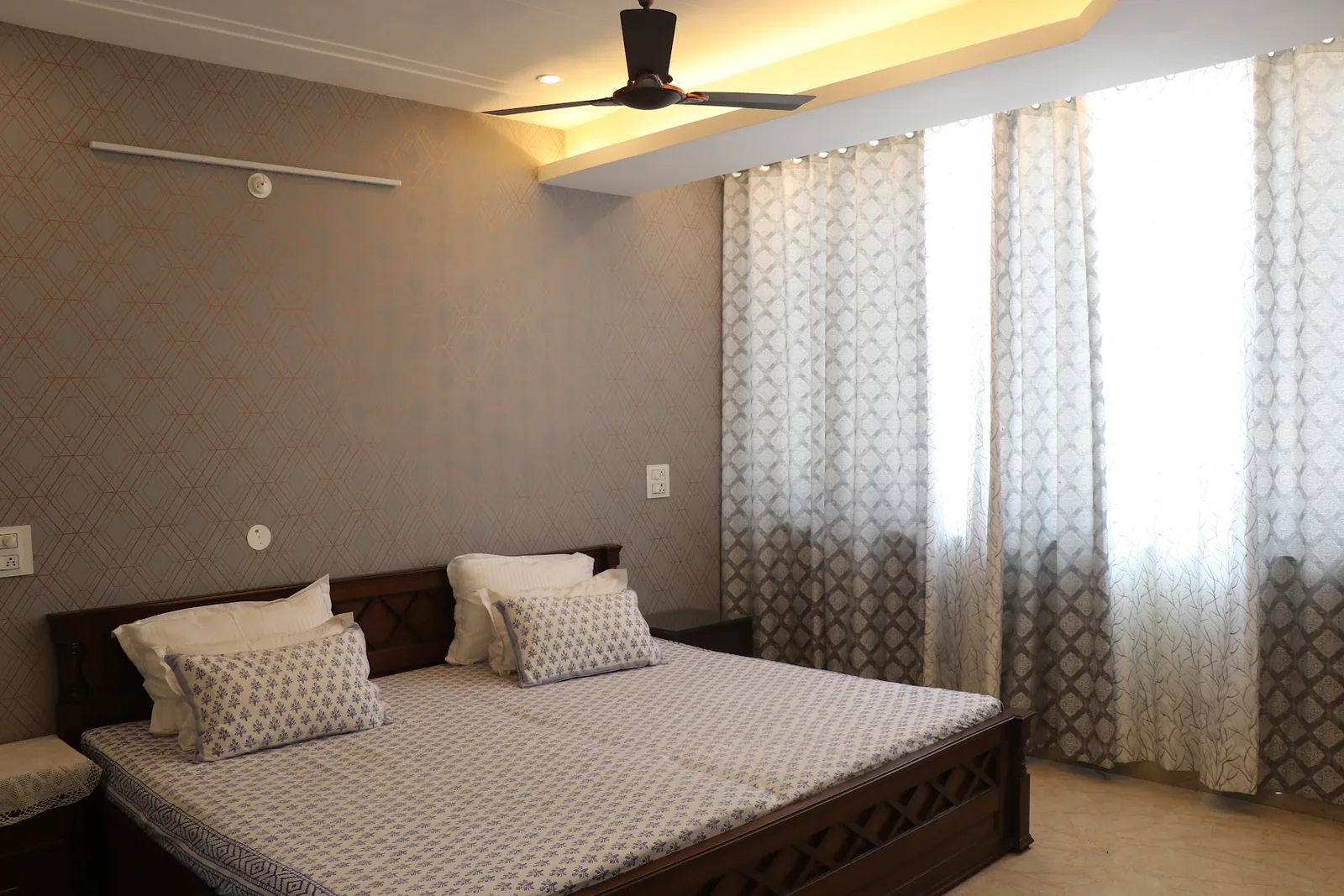 Bedroom with large windows at Little Sparrow Homestay, Rishikesh