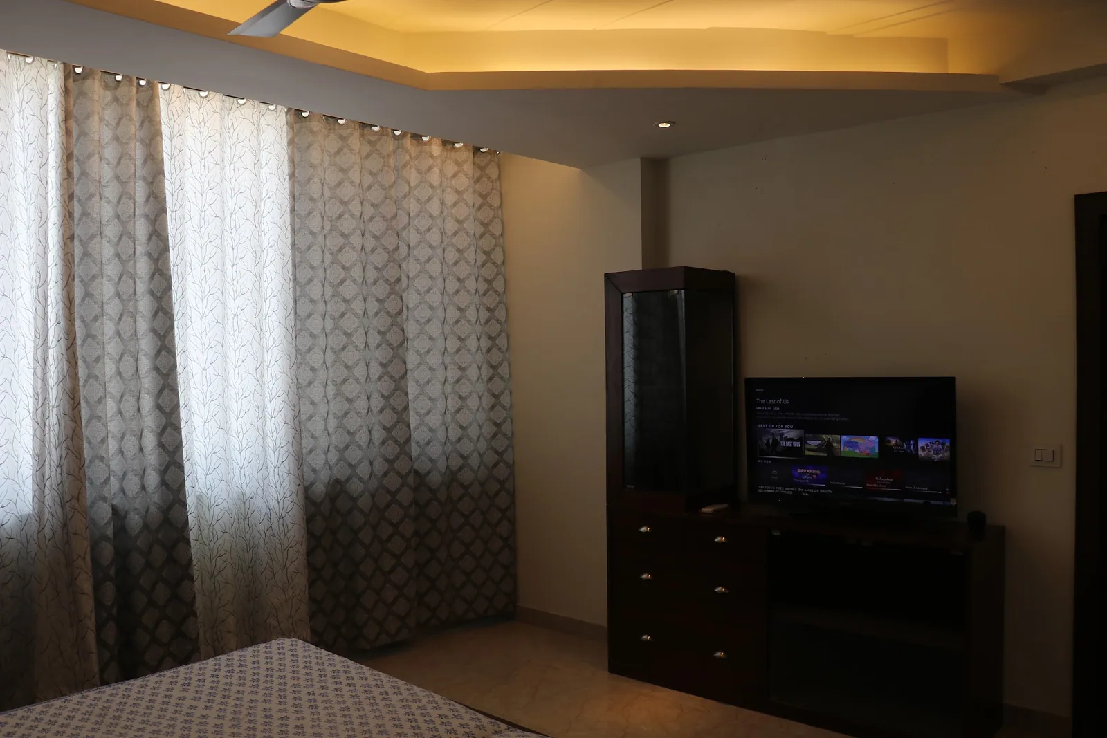 Room with a television at Little Sparrow Homestay, Bharat Vihar, Rishikesh