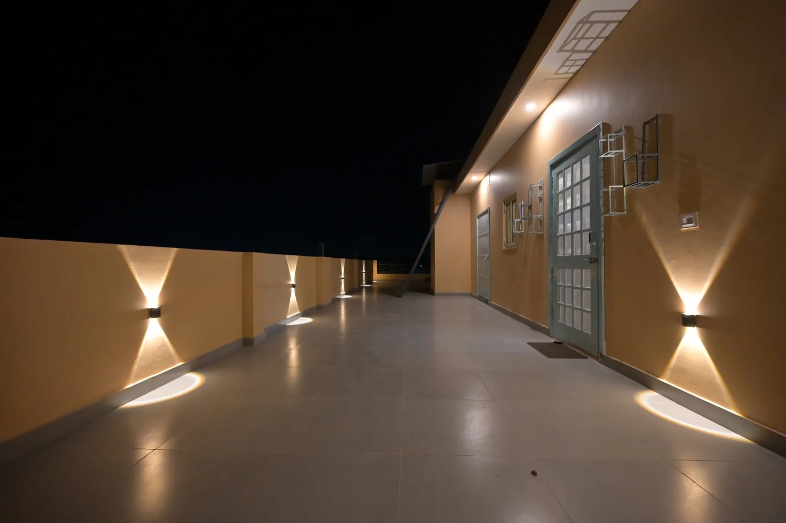 The lit walkway outside the rooms at Little Sparrow Homestay, Rishikesh