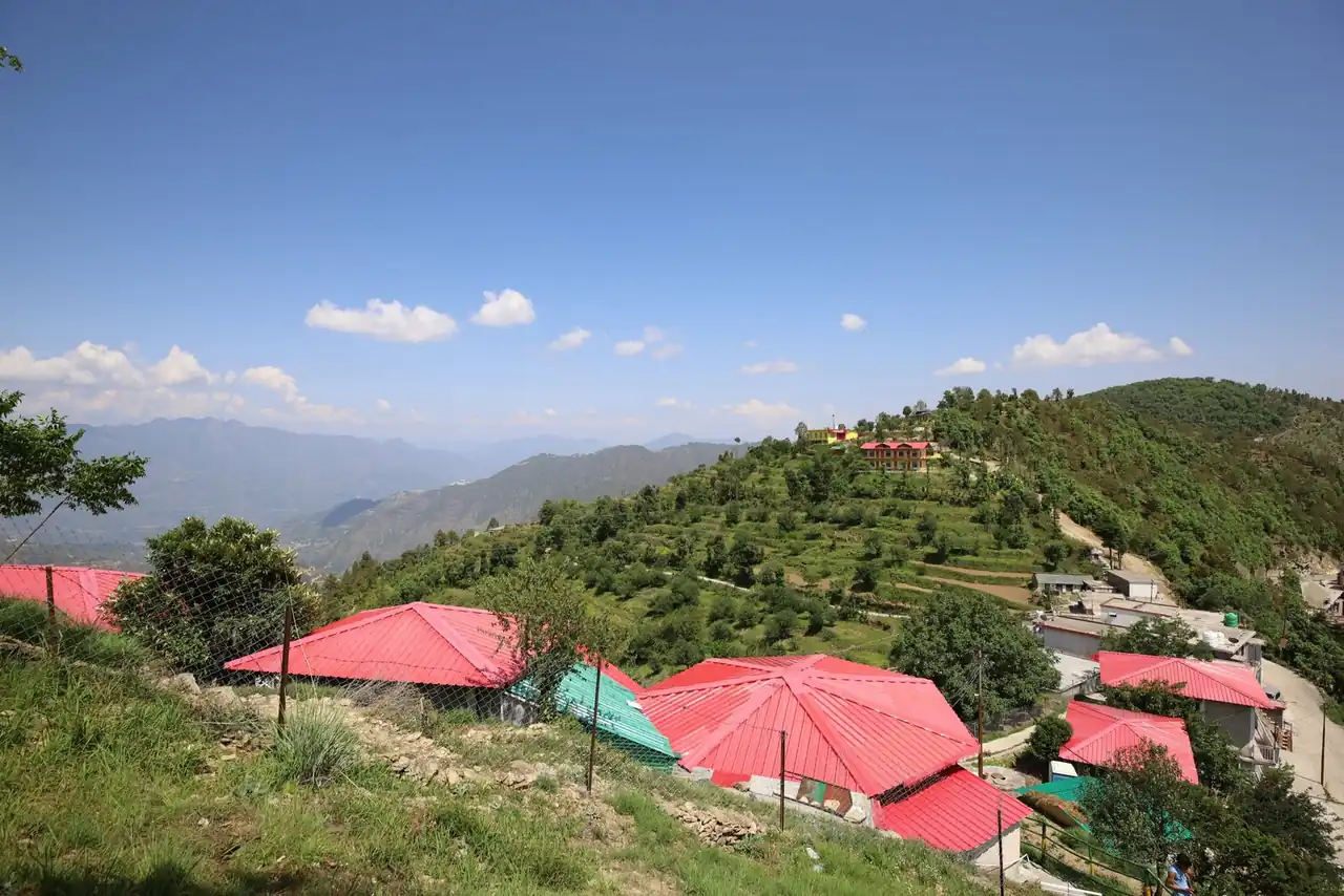 Valley view over the cottage roofs at Pahadi House Kanatal