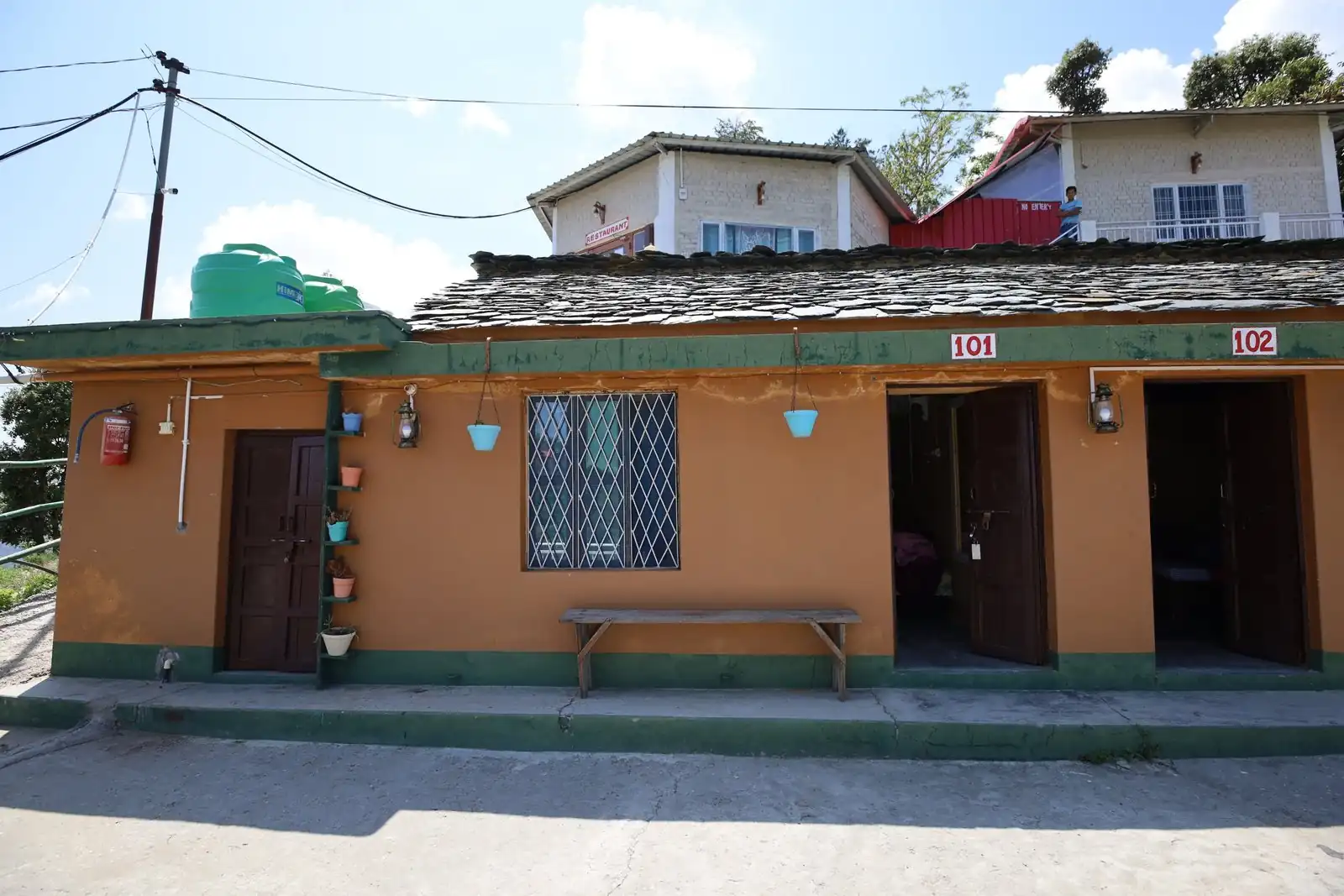 Cottage block with numbered rooms at Pahadi Ghar Kanatal