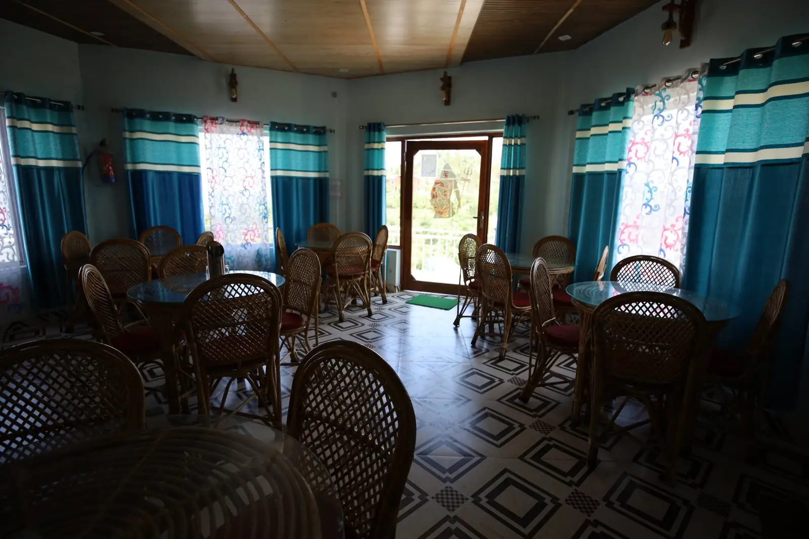 Cafe seating with mountain-facing windows