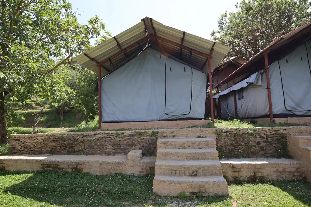 Alpine tents pitched on the terraced garden