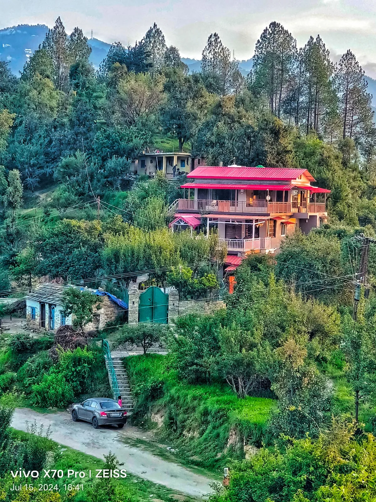 WindyRidge villa seen from above, set in its plum orchard at Darima near Mukteshwar