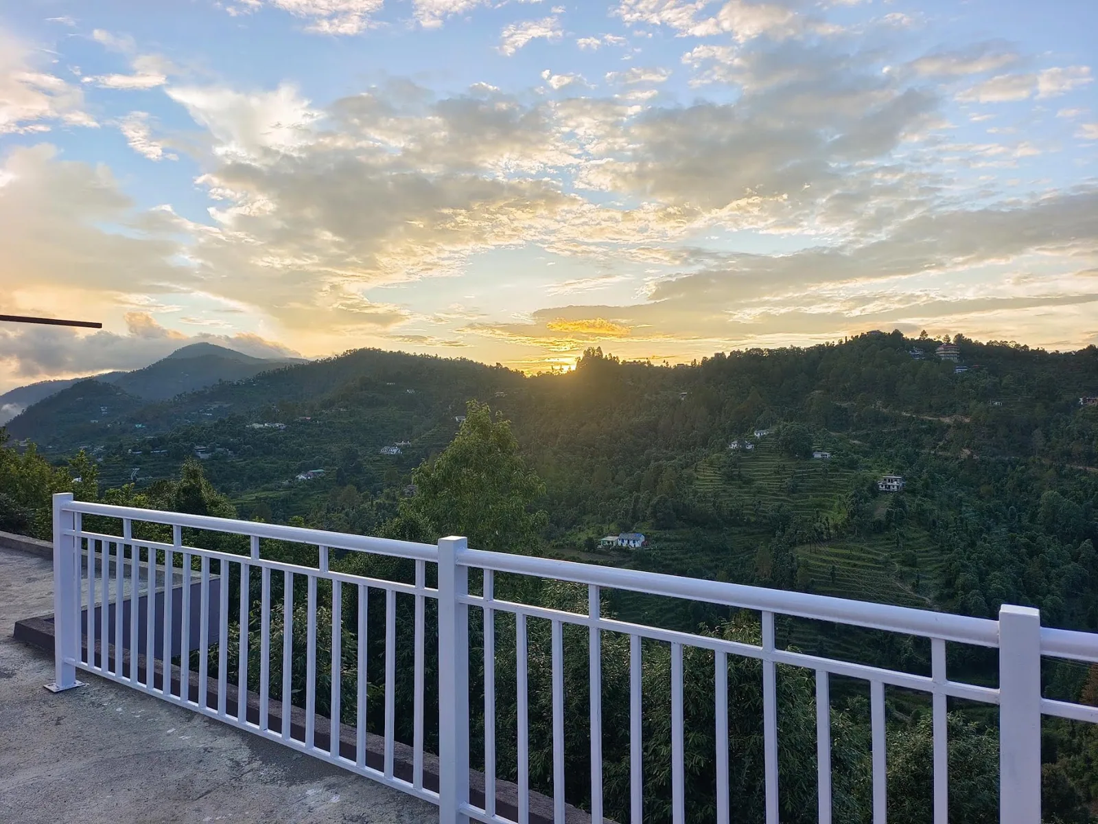 Sunset over the valley from the deck at WindyRidge, Mukteshwar