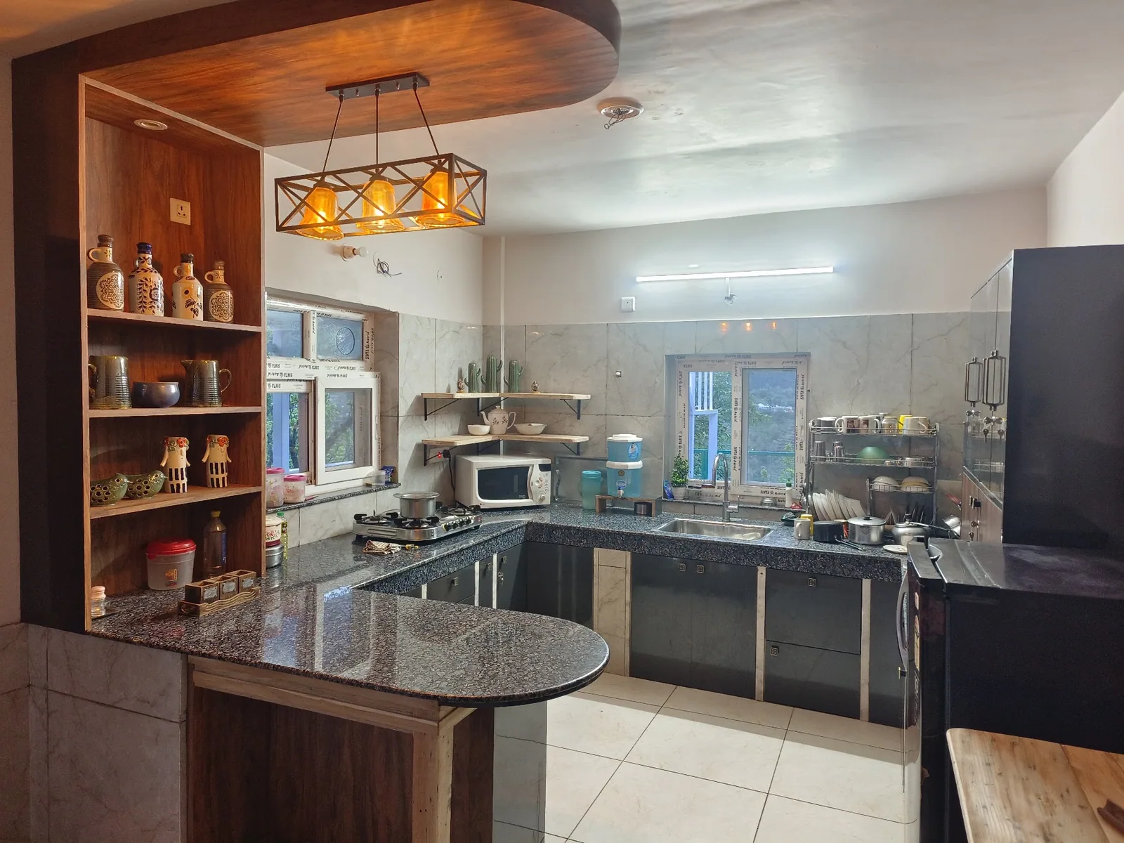 Kitchen counter and cabinets at WindyRidge Plum Orchard Villa, Mukteshwar