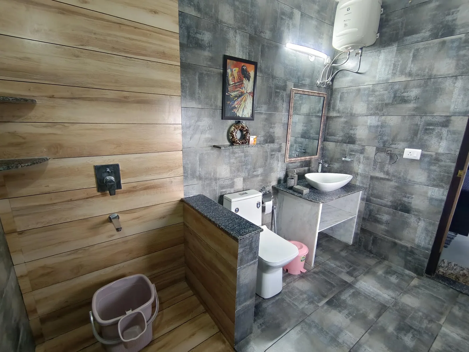 Bathroom with a stone tiled wall at WindyRidge, Mukteshwar