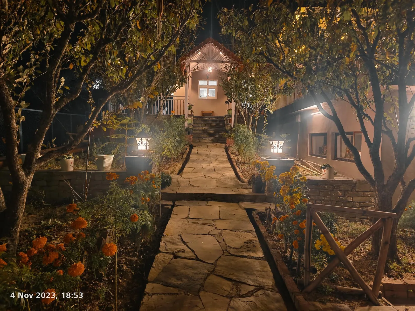Lit path through the plum orchard at dusk, WindyRidge, Mukteshwar