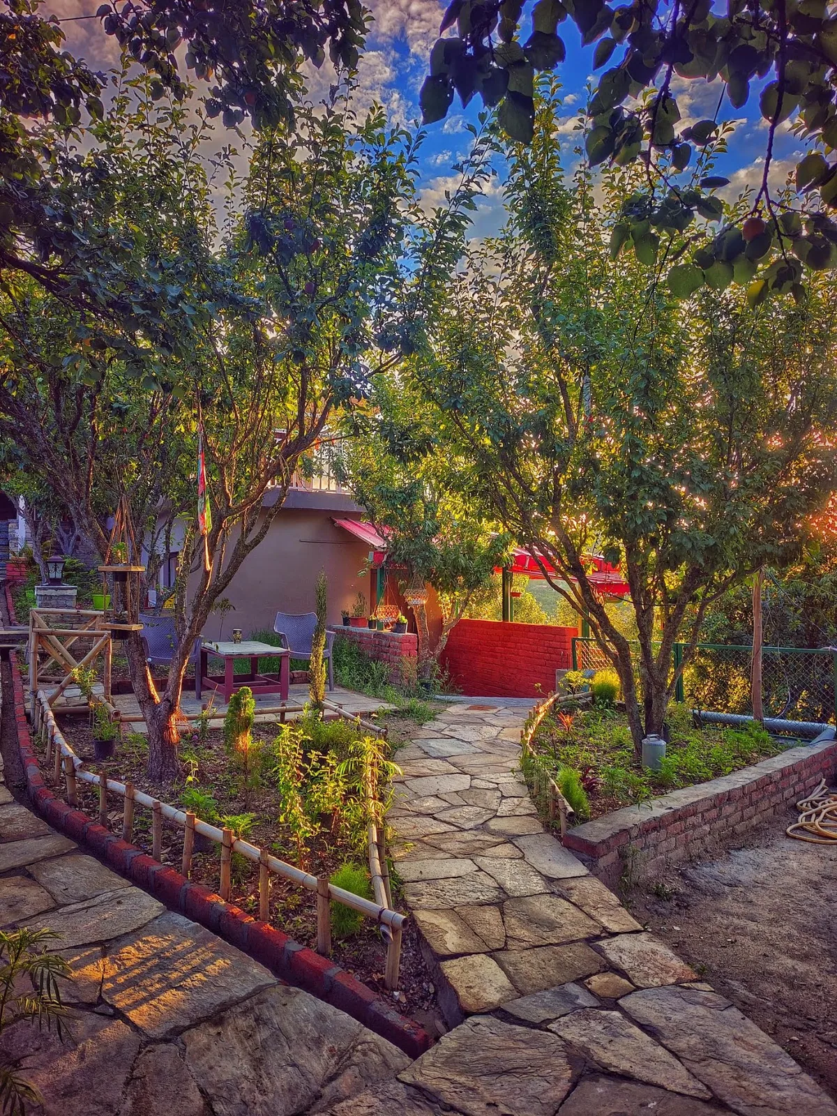 Seating among the fruit trees in the orchard at WindyRidge, Mukteshwar